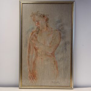 Puck in its silver- and gold-coloured frame