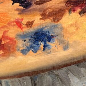 Detail of the painter's palette with various colours of oil paint